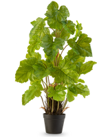 La plante artificielle Melon Leaf 90 cm est une grande plante artificielle avec de larges feuilles vertes brillantes et plusieurs tiges dressées, qui se dresse dans un simple pot noir sur un fond blanc uni.