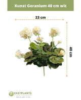 Géranium artificiel 40 cm blanc : plante artificielle aux feuilles vertes, hauteur 40 cm et largeur 23 cm, joliment mise en valeur sur un fond blanc aux dimensions claires.