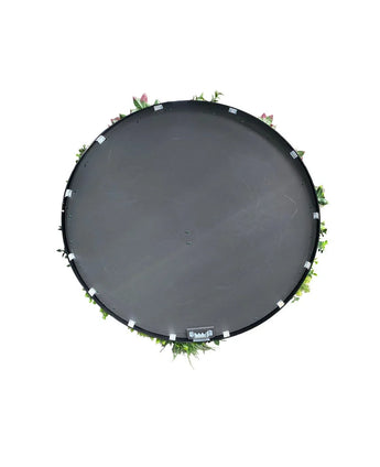 Haie Artificielle sur trampoline Cadre Noir Ø100 cm, vue de dessus avec des feuilles vertes et des fleurs roses sur le pourtour, sur fond blanc.