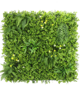 La Haie Artificielle Jonquille Smile 100x100 cm UV est un mur végétal vertical carré au feuillage vert dense, des fougères et des petites fleurs jaunes et blanches, sur un fond blanc vu de dessus.