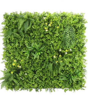 La Haie Artificielle Jonquille Smile 100x100 cm UV est un mur végétal vertical carré au feuillage vert dense, des fougères et des petites fleurs jaunes et blanches, sur un fond blanc vu de dessus.