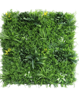 La Haie Artificielle Moment 100x100 cm UV est un panneau carré densément recouvert de plantes vertes artificielles, de fougères, de pétioles et de petites fleurs jaunes éparses sur fond blanc.