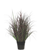 Le gazon artificiel Wild Lawn de 70 cm, ignifuge, a des feuilles étroites vert foncé et rouge-violet dans un pot noir - parfait comme plante sans entretien pour n'importe quel intérieur.